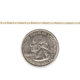 Two-tone gold-filled plus sterling silver chain next to a U.S. quarter dollar coin for scale